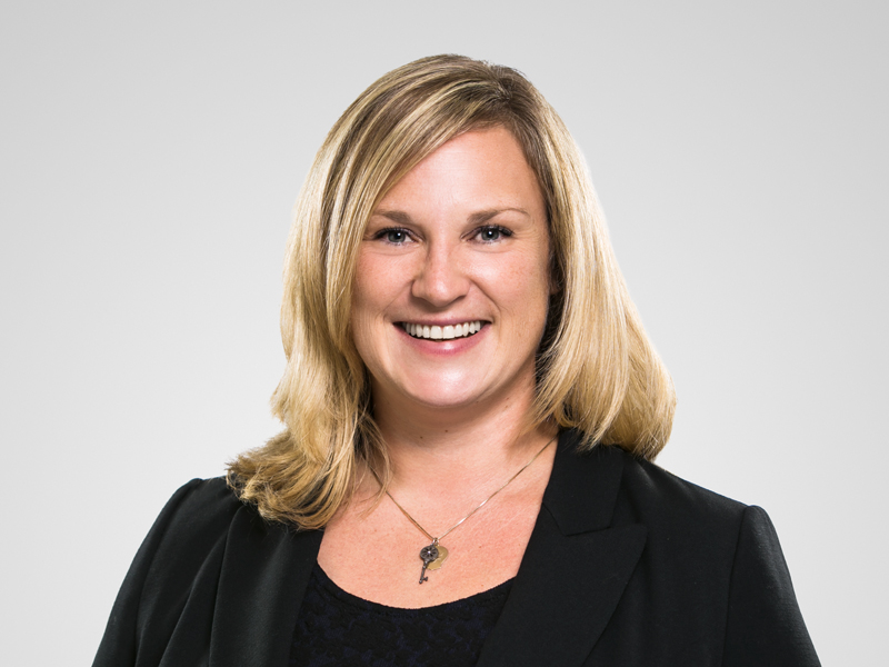 Amy Roost Harneys fiduciary front portrait image on a grey background