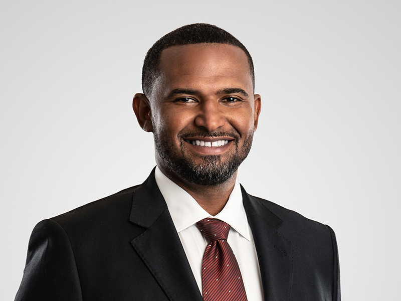 William Peguero Harneys fiduciary front portrait image on a grey background